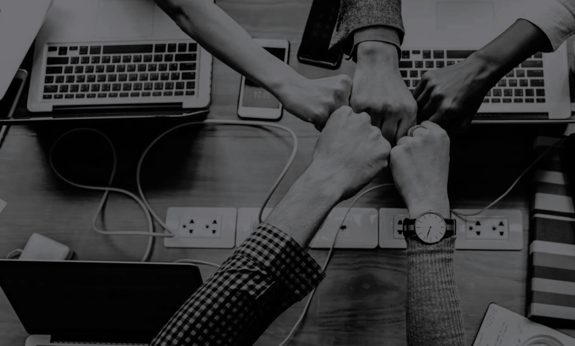 Teamwork - hands meeting over work table