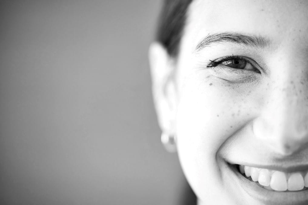 A close-up of a smiling woman