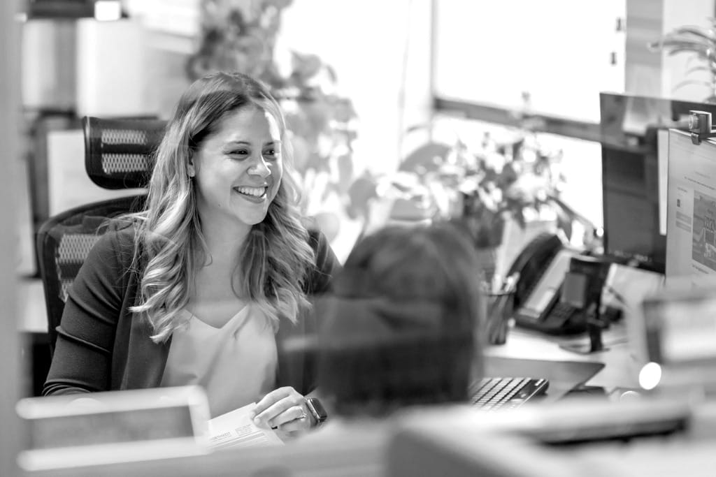 A woman in an office with a coworker