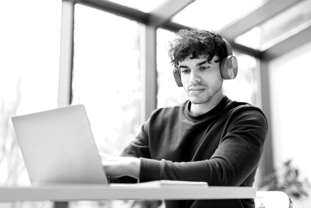 A young man engaged in eLearning